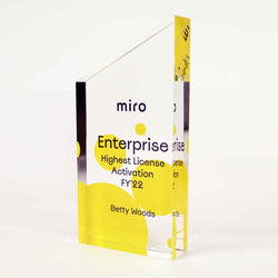 Bespoke custom trophies in unique geometric shapes, combining premium materials with precision-engraved company branding. North American Handcrafted. 