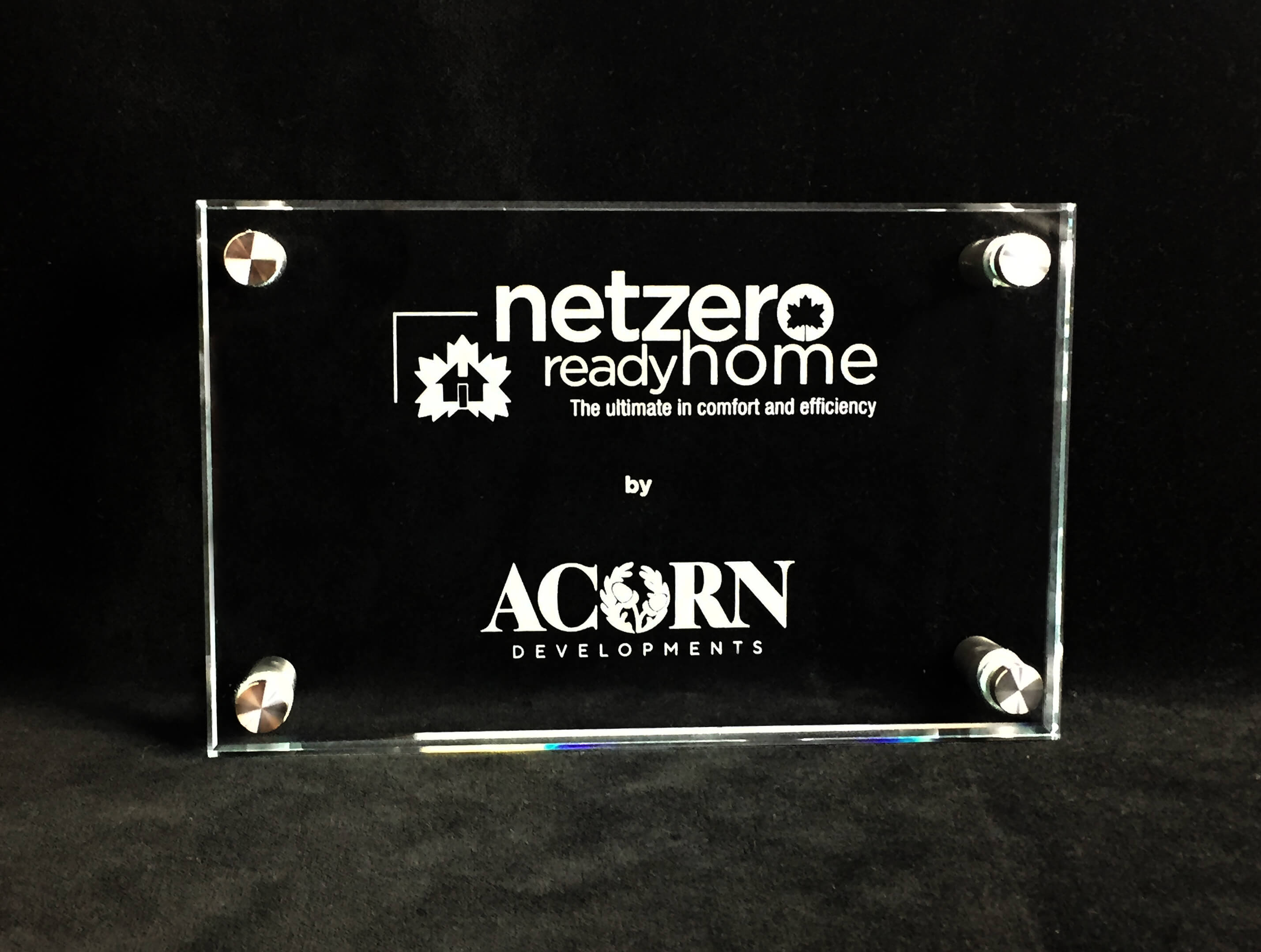 custom-award_unique_certification-program_glass_stainless-steel-standoffs_net-zero_wall-plaque_north-america